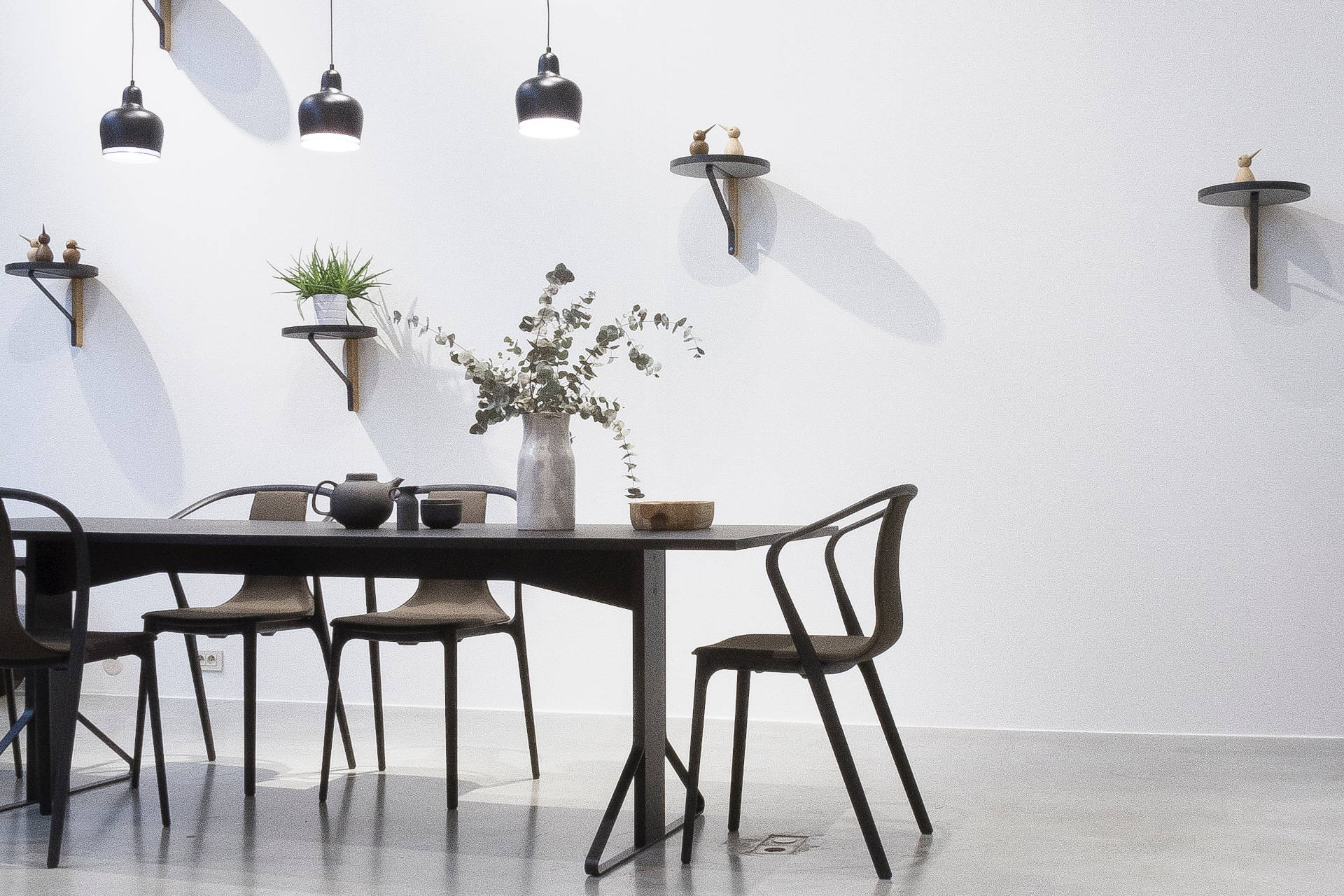 Black dining set in a light room