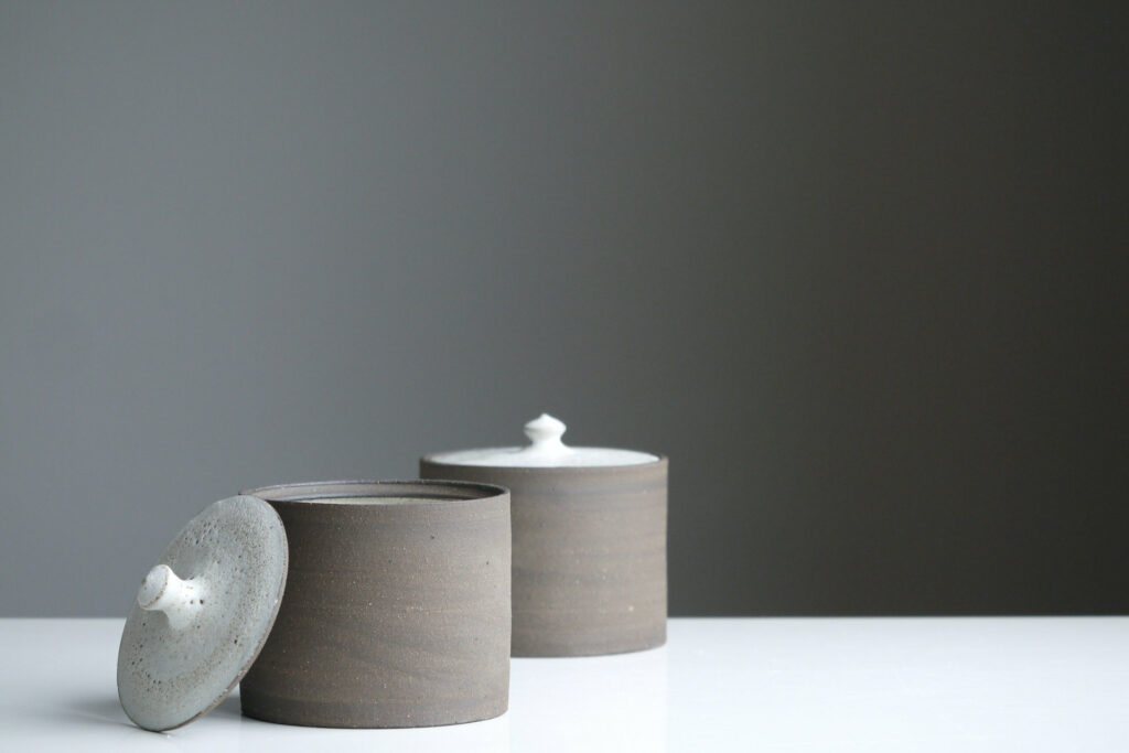 Two pots on a white table